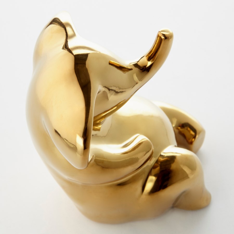 Gold elephant sculpture. - The Nifty Decor