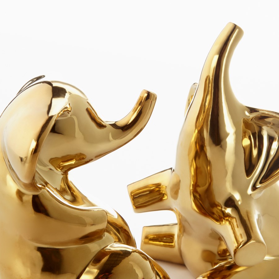 Gold elephant sculpture. - The Nifty Decor