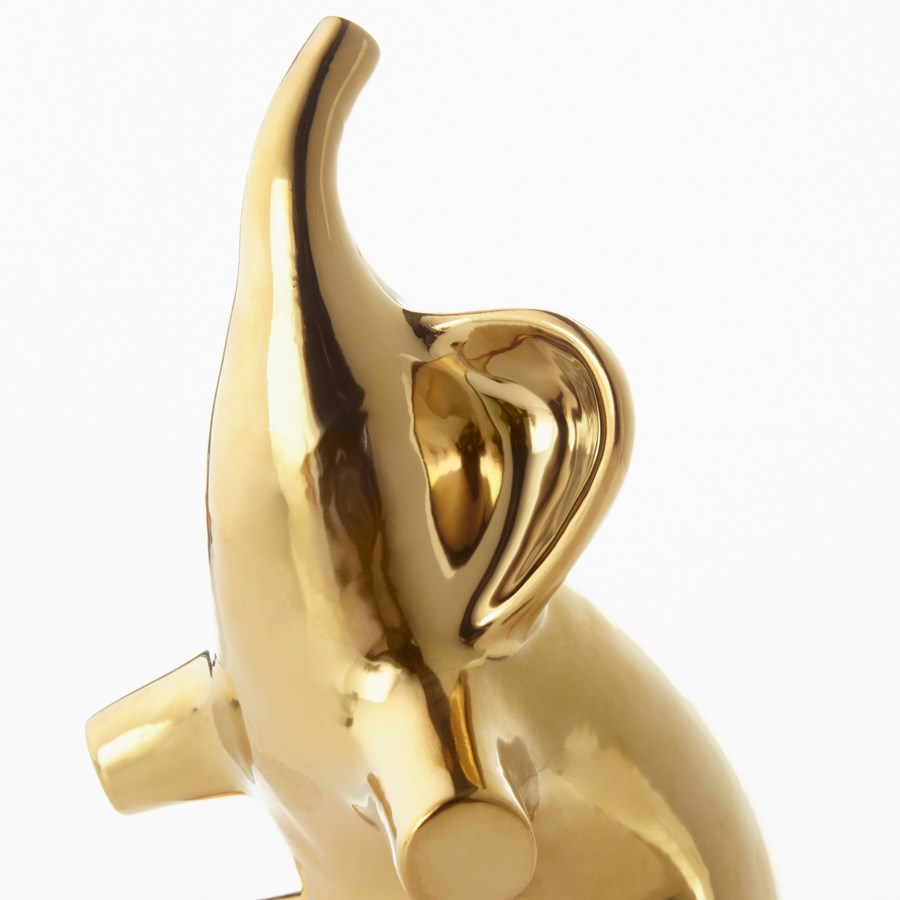 Gold elephant sculpture. - The Nifty Decor