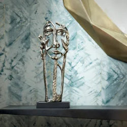 Sculpture depicting facial forms - Bombay Mercantile