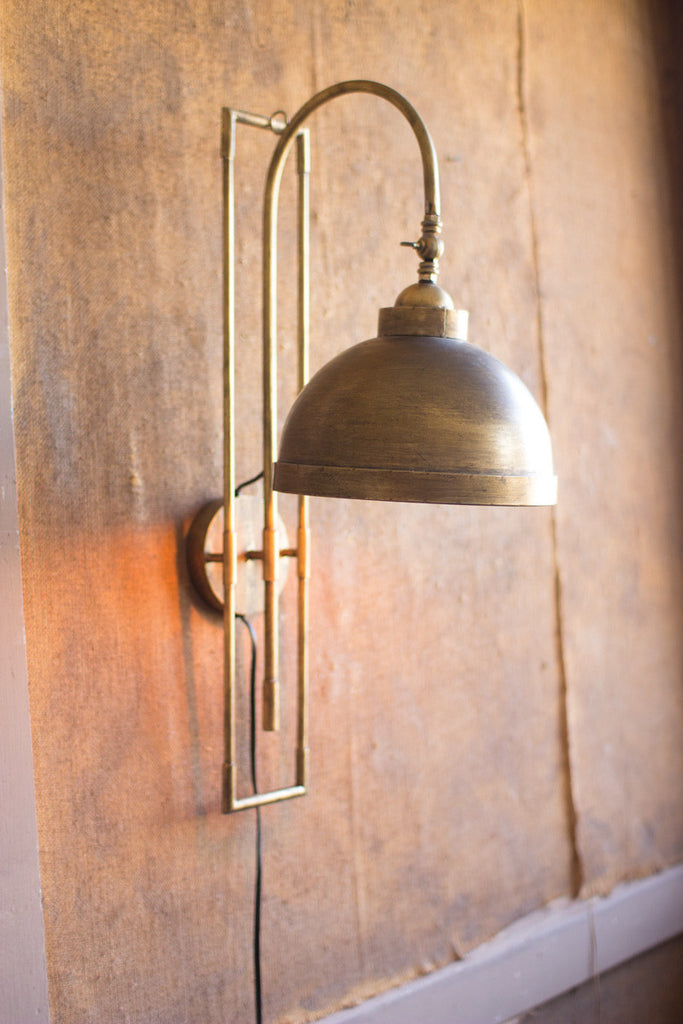 Metal wall light with antique brass finish - The Nifty Decor