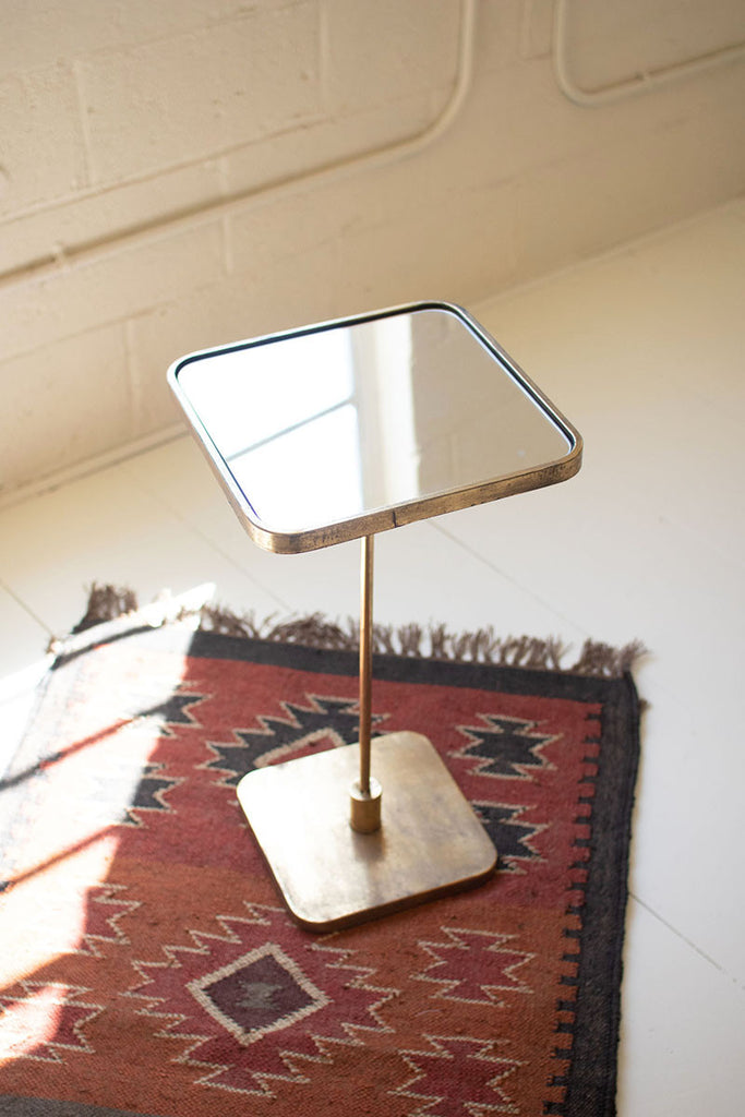 Accent cocktail table with mirror top - The Nifty Decor