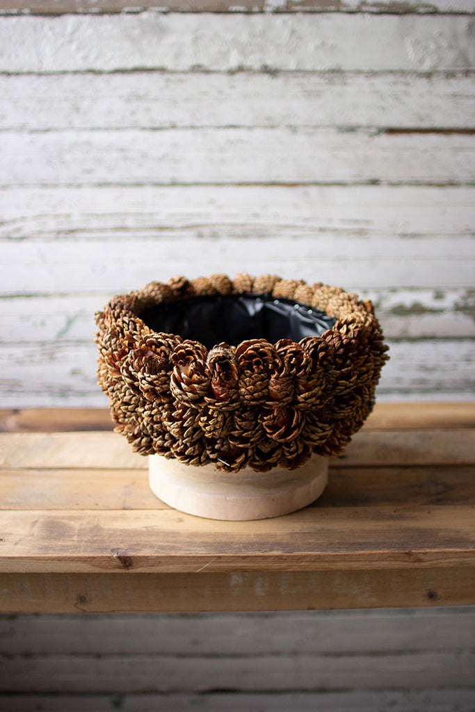 Pinecone urn with turned wood bases - The Nifty Decor