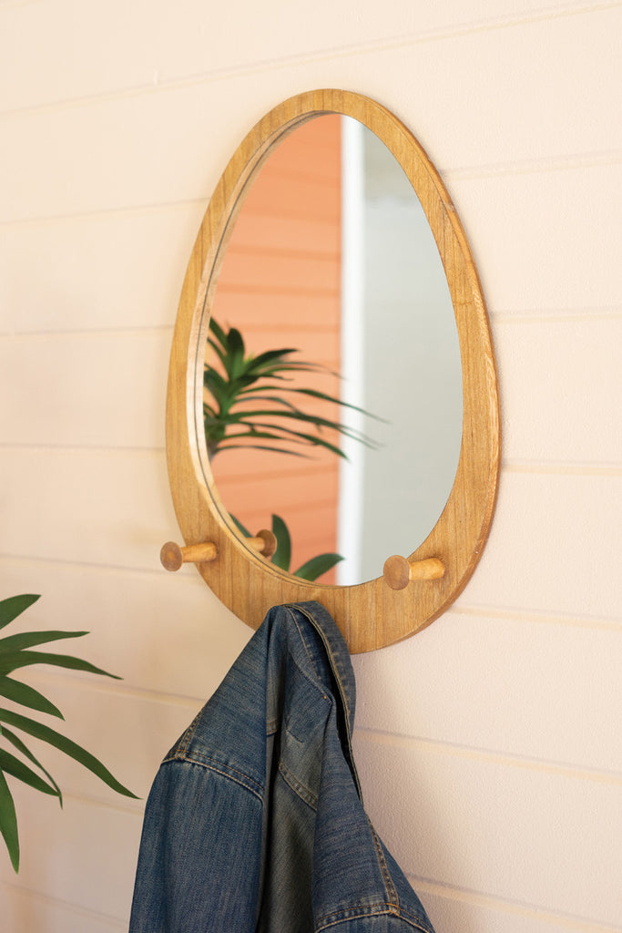 Oval wood framed mirror with coat hooks - Bombay Mercantile