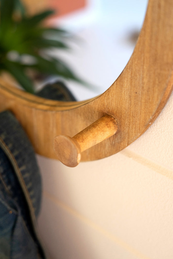 Oval wood framed mirror with coat hooks - Bombay Mercantile