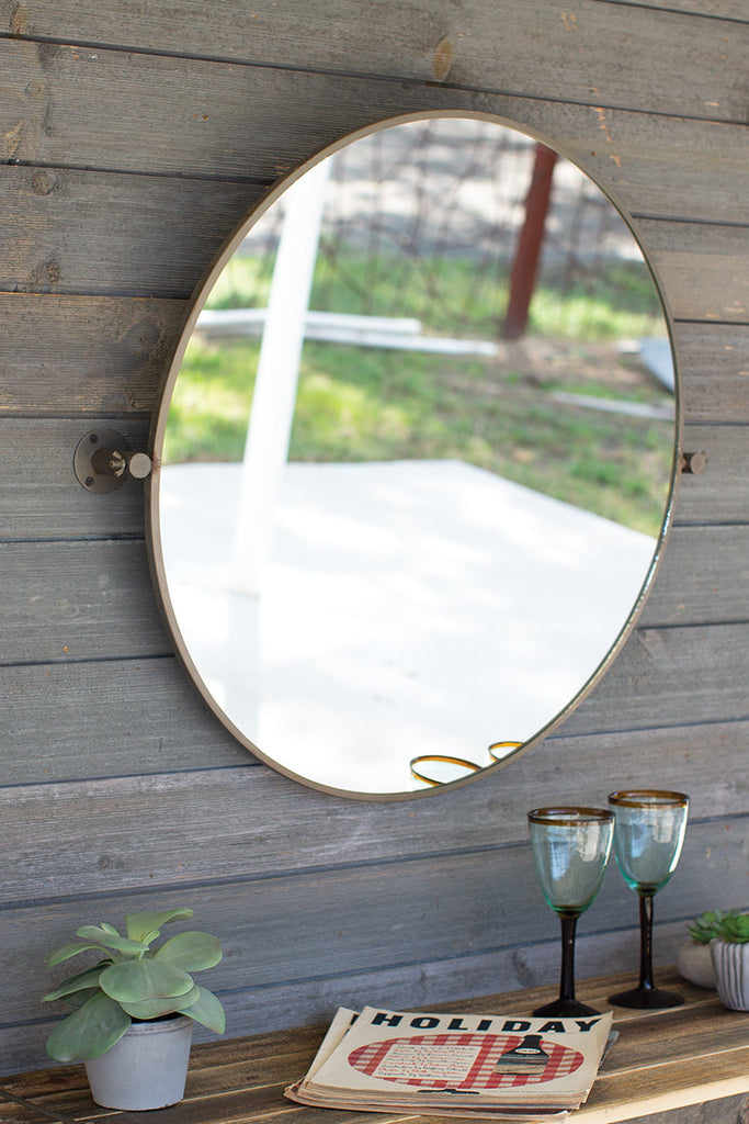 Tilted round mirror - The Nifty Decor