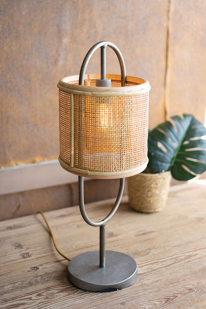 Metal tabletop lamp with round rattan shade and metal base - The Nifty Decor