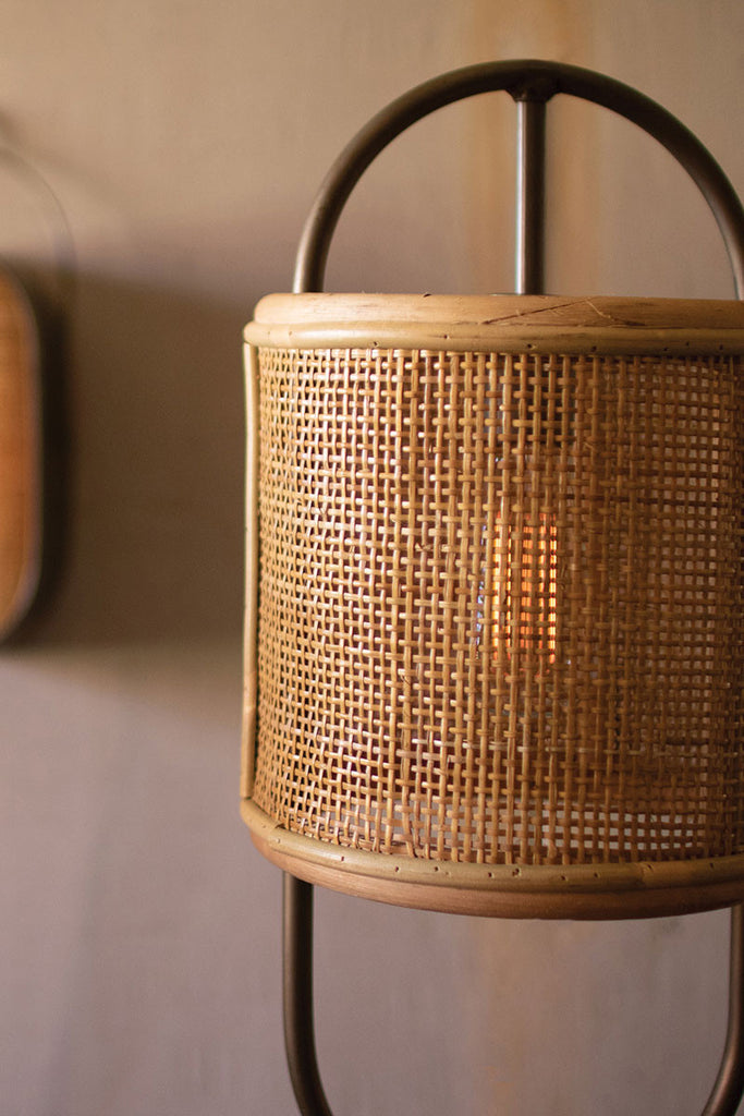 Metal tabletop lamp with round rattan shade and metal base - The Nifty Decor