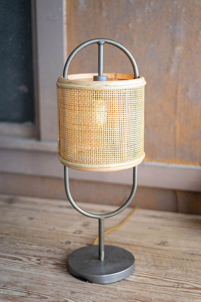 Metal tabletop lamp with round rattan shade and metal base - The Nifty Decor