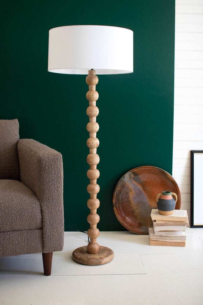 Carved wooden floor lamp with off-white barrel shade - Bombay Mercantile