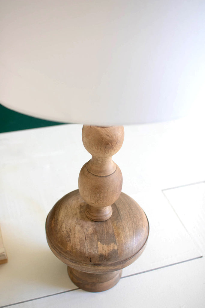 Carved wooden table lamp with off-white barrel shade - Bombay Mercantile