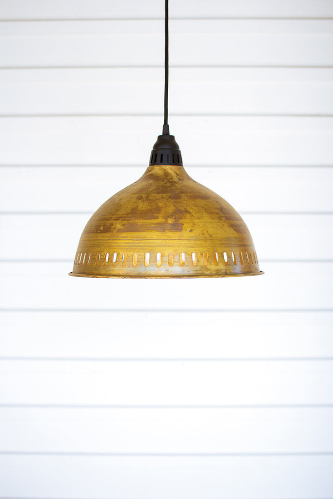 Antique brass pendant light with perforated detail - The Nifty Decor