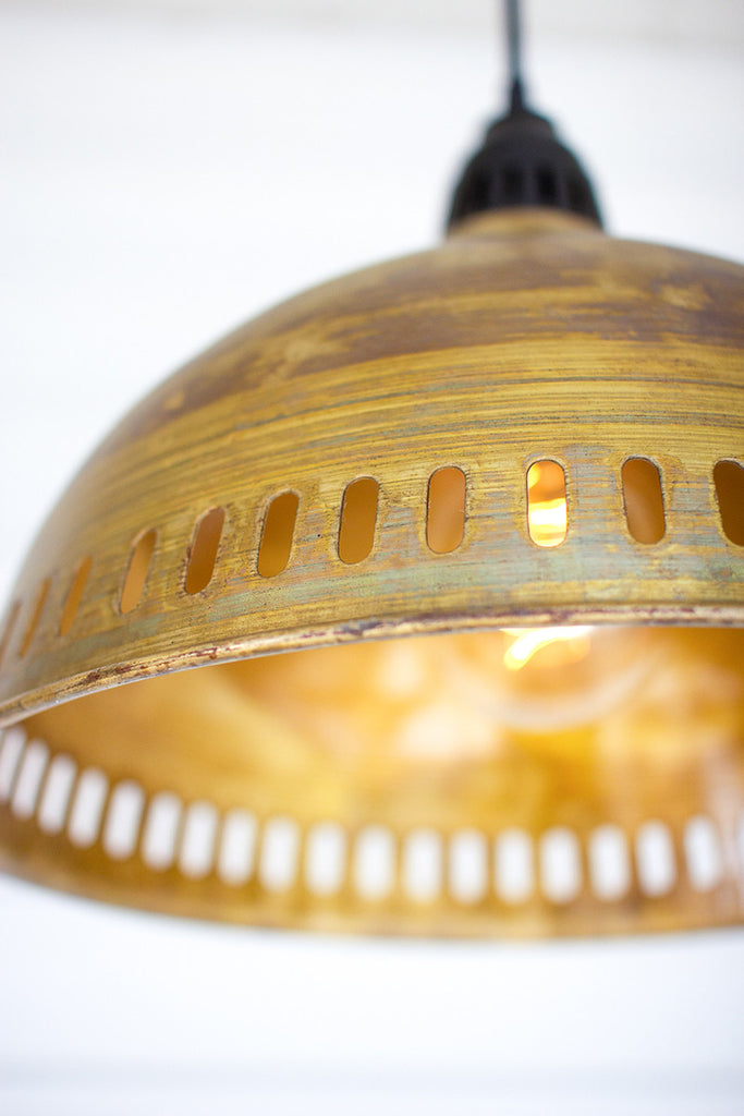 Antique brass pendant light with perforated detail - The Nifty Decor