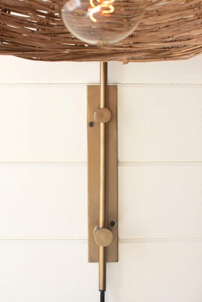 Antique brass wall light with rattan shade - Bombay Mercantile