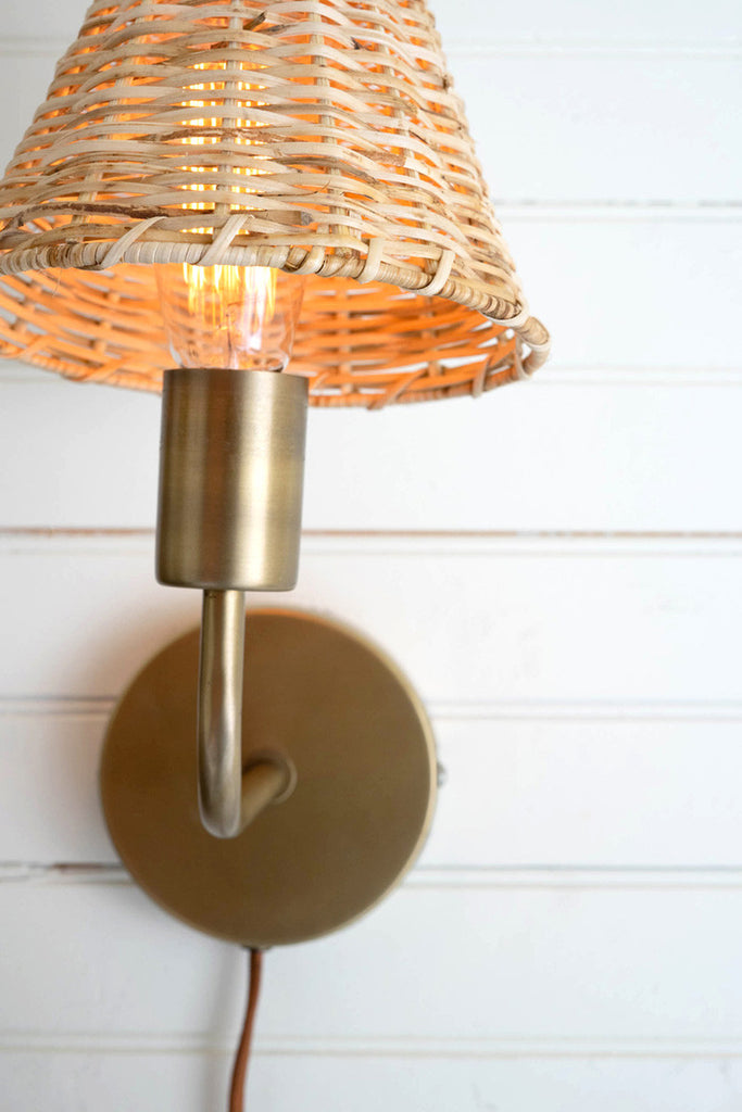 Double antique brass wall lamp with woven wicker shade - Bombay Mercantile