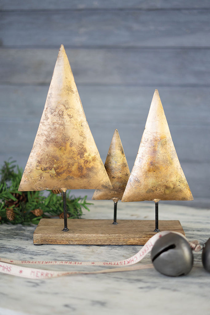 Three antique gold christmas trees on a wooden base - The Nifty Decor