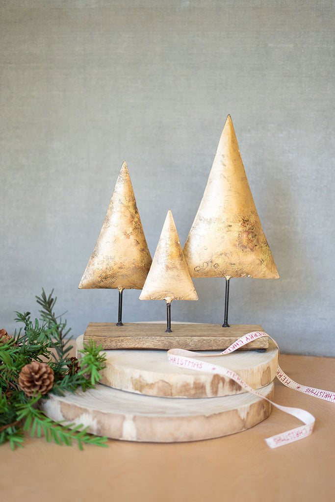 Three antique gold christmas trees on a wooden base - The Nifty Decor