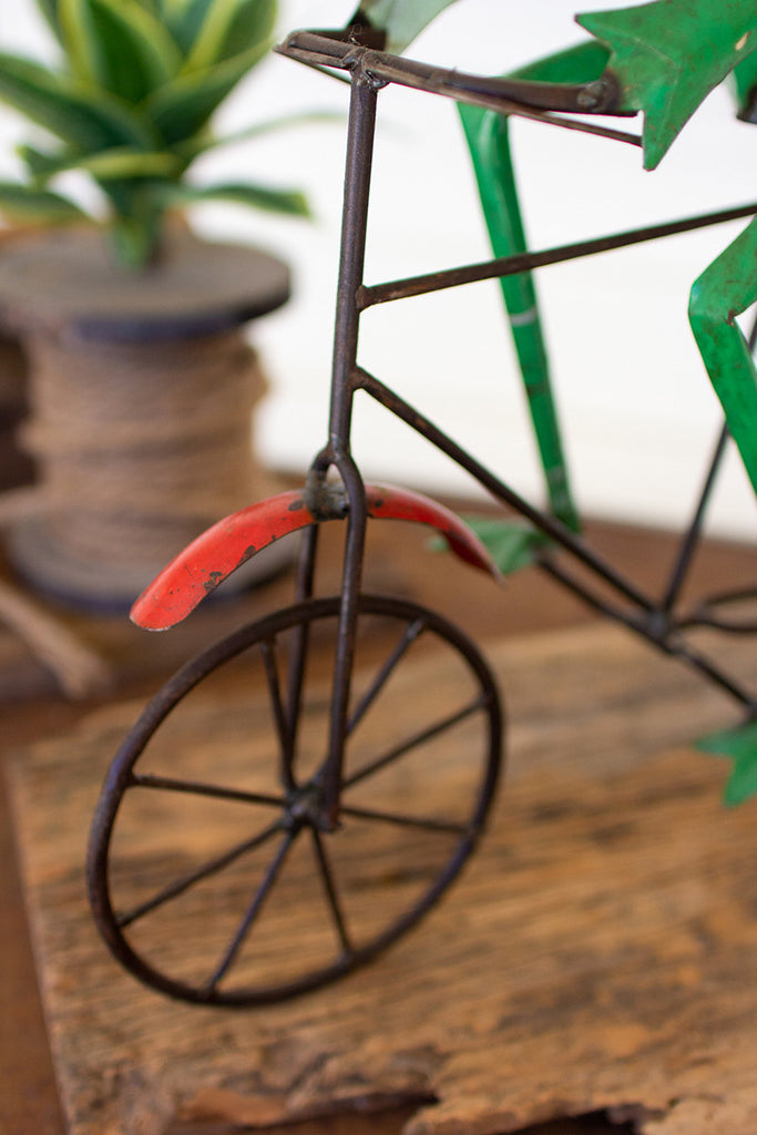 Frog on a bicycle with pot - The Nifty Decor