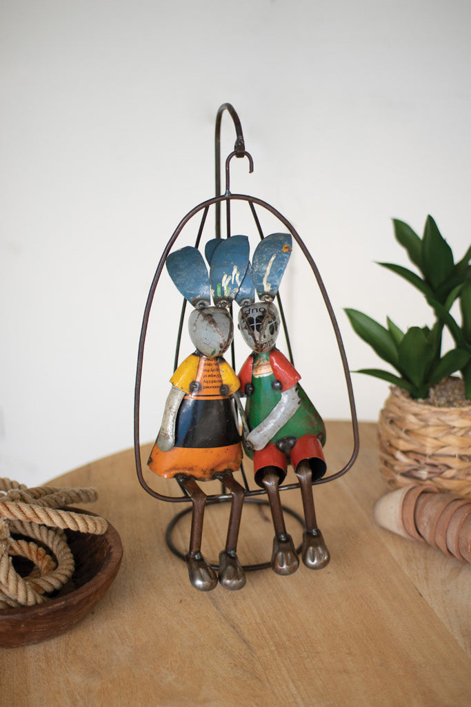 Two recycled iron rabbits on a swing - Bombay Mercantile