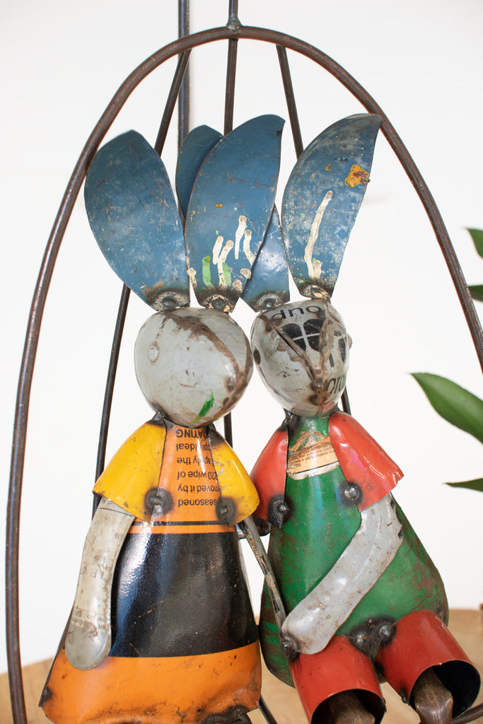 Two recycled iron rabbits on a swing - Bombay Mercantile